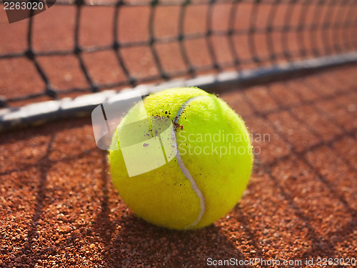 Image of tennis ball on a tennis court