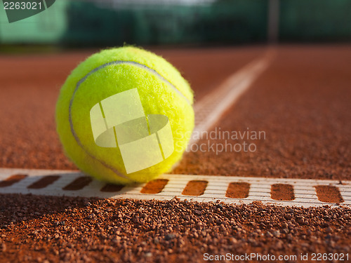 Image of Yellow ball on the court ground