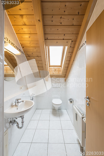 Image of White tiled restroom