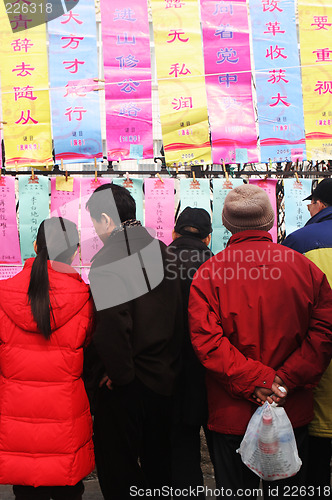 Image of People read good luck messages in China. Chinese New Year celebr