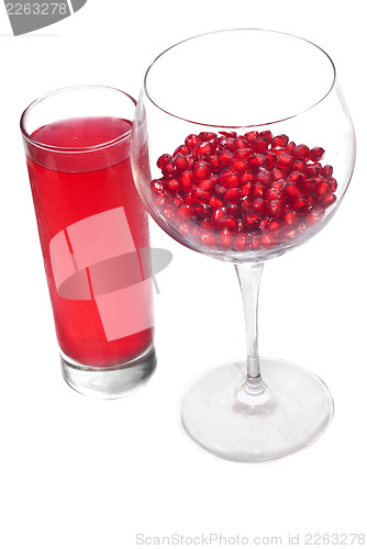 Image of fresh grains and juice pomegranate in glass