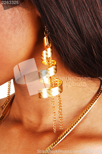 Image of Closeup of gold earring.