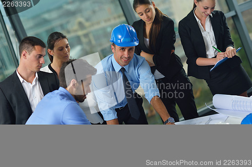 Image of business people and engineers on meeting