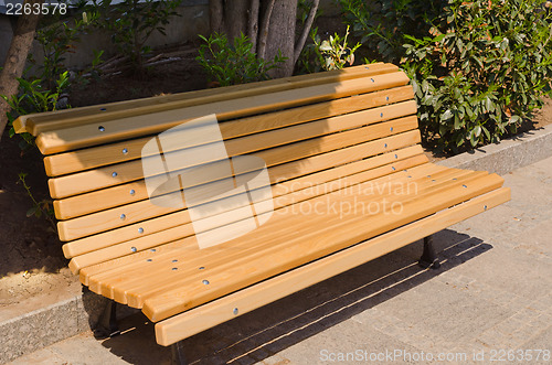 Image of yellow park bench