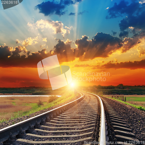 Image of dramatic sunset over railroad