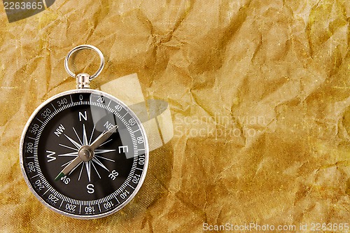 Image of Compass on the grunge  background