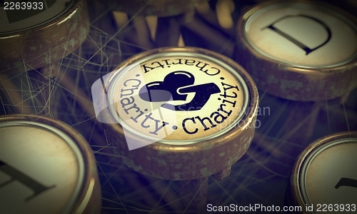 Image of Charity Typewriter Key. Grunge Background.