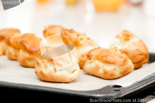 Image of delisious profiteroles on the baking tray