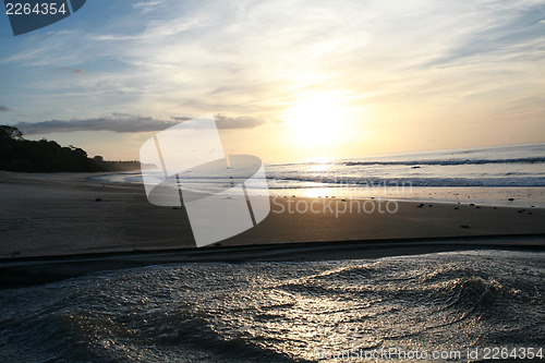 Image of Sunrise over sea and lake