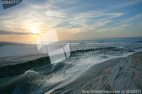 Image of seascape in twilight.  Sea joining with the lake.