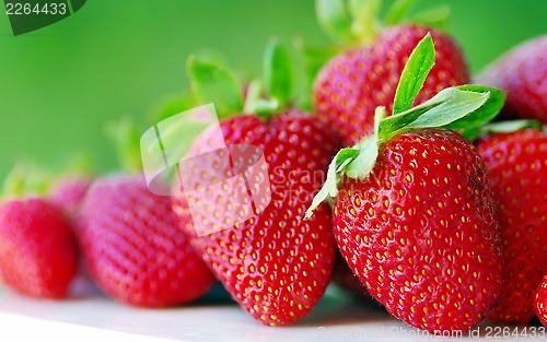 Image of fresh strawberry on the clean green background