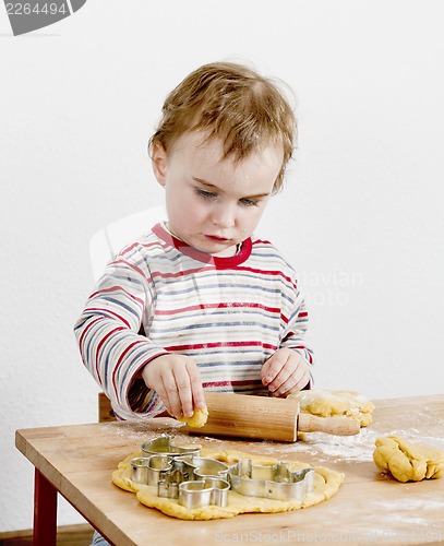 Image of young child making cookies