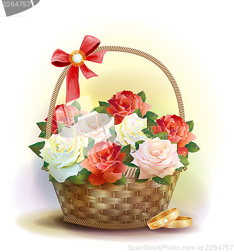 Image of Wedding card.    Rings and  wicker basket  with roses.