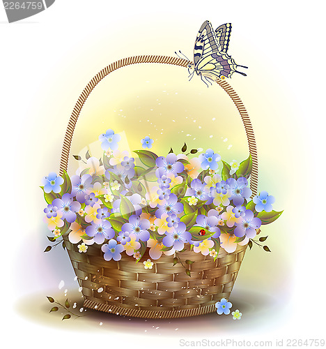 Image of Wicker basket with violets. Victorian style.