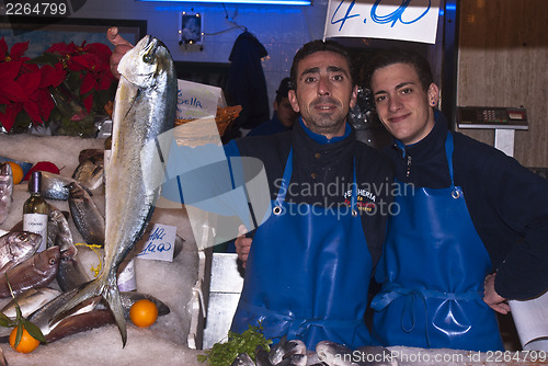 Image of men selling fish