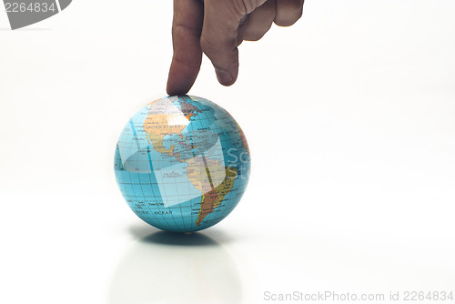 Image of world in a finger