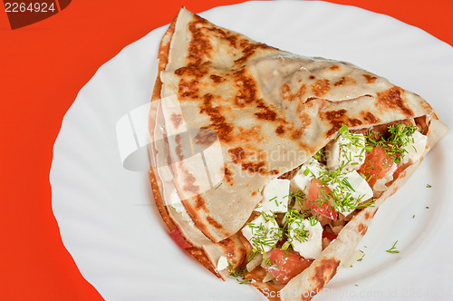 Image of pancakes with cheese and vegetables