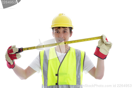 Image of Apprentice holding builders tape measure