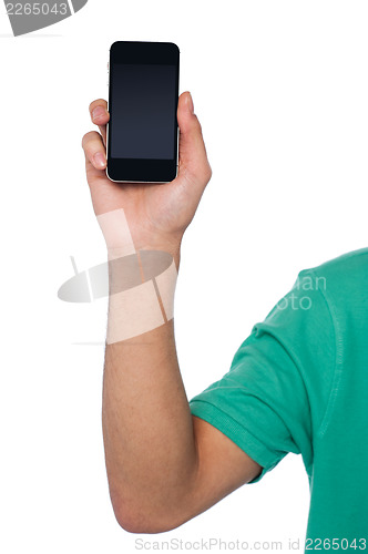 Image of Cropped image of a guy displaying mobile handset