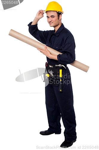 Image of Construction worker holding building blueprint