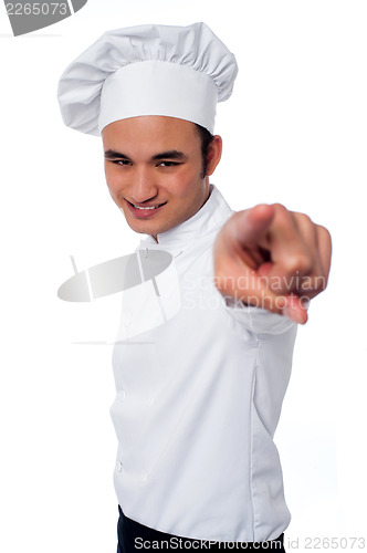 Image of Smart young chef pointing at camera
