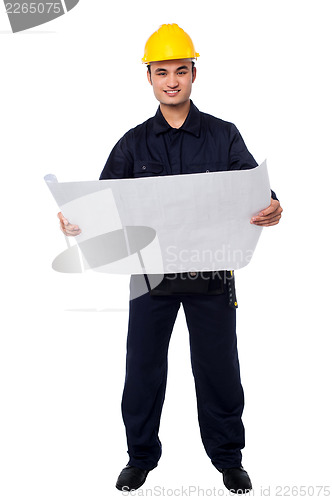 Image of Male architect with construction plan