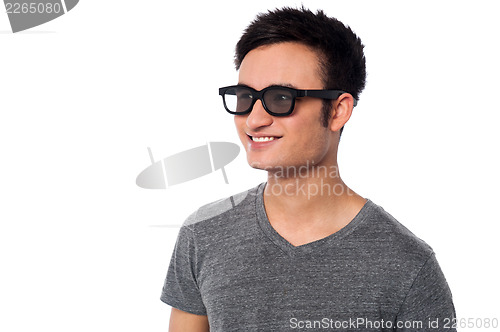 Image of Young happy man wearing dark sunglasses