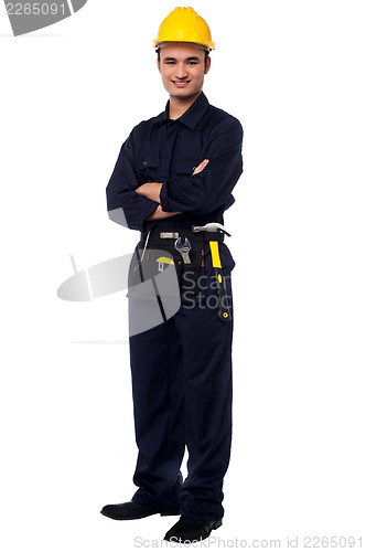 Image of Young worker in a hard hat with his tools