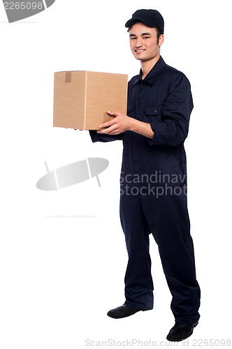 Image of Young boy delivering parcel