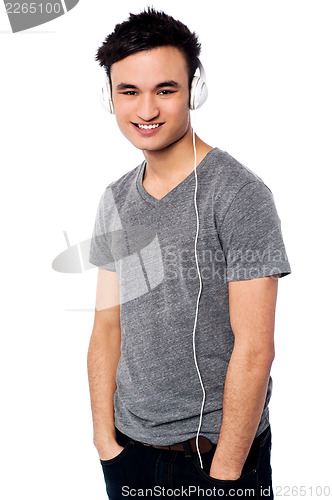 Image of Young guy enjoying music