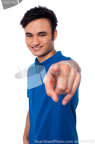 Image of Young man pointing finger at you