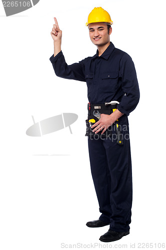 Image of Construction worker pointing upwards