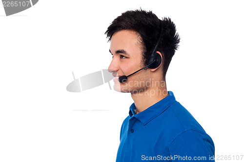 Image of Young friendly guy wearing headset