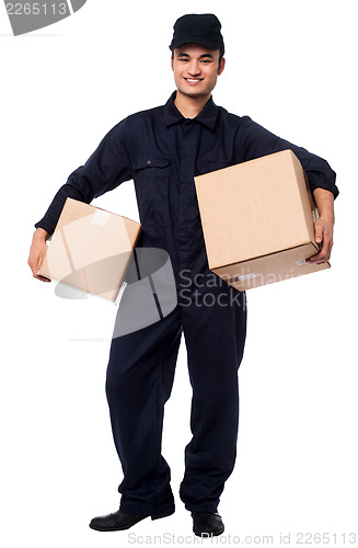 Image of Young courier boy holding parcels