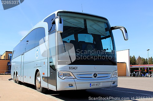 Image of Blue Mercedes Benz Bus on a Bus Stop