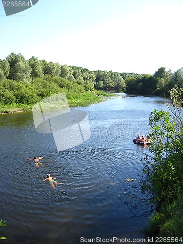 Image of beautiful landscape with river, canoe and people