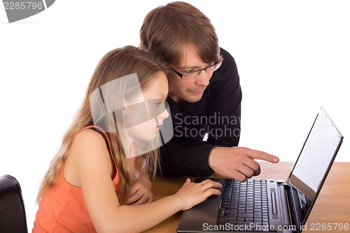 Image of Father and daughter working on a laptop