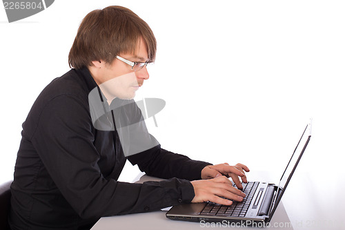 Image of Man working on a laptop