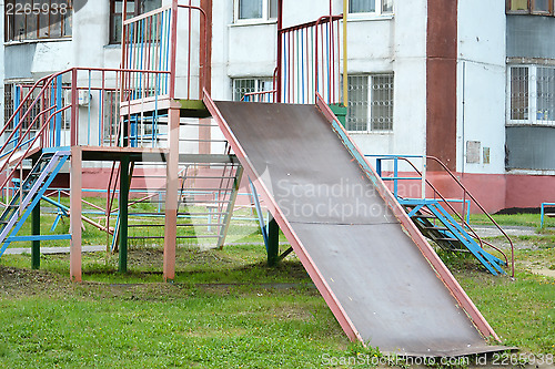 Image of empty children's hills in a house yard