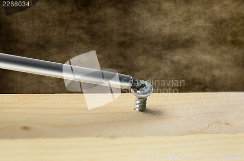 Image of Screw and Screwdriver