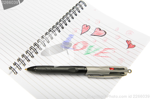 Image of Love Written in Notebook With a Pen.