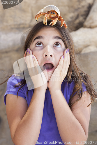 Image of Young Girl Playing with Toy Hermit Crab