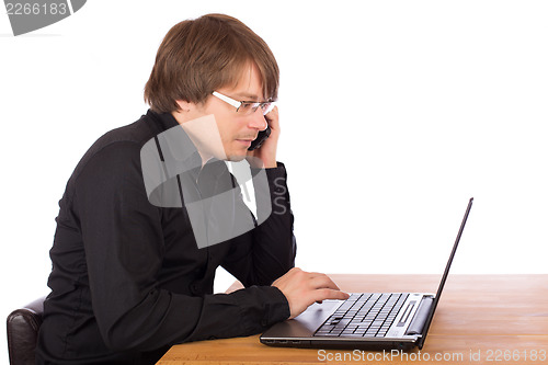 Image of Business man working on a laptop