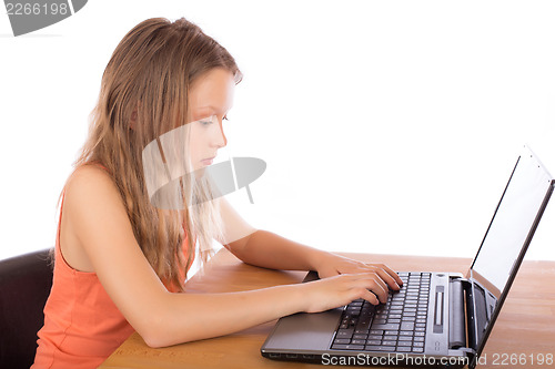 Image of Young girl working on a laptop