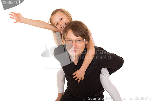 Image of Man giving piggyback ride to a little girl