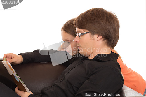 Image of Father read a book with his daughter