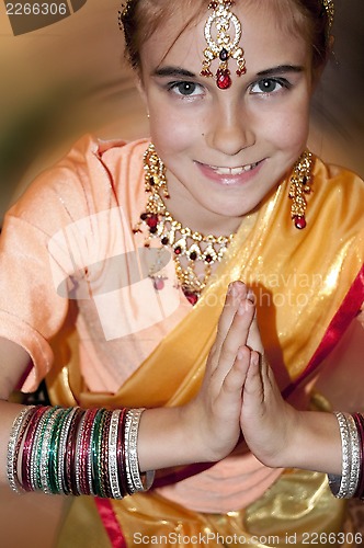 Image of child wearing bridal Indian clothing 