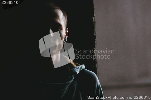 Image of Portrait of a male model in the dark