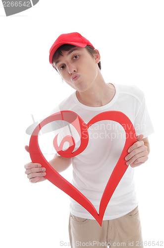 Image of Teenager holding red love heart kiss