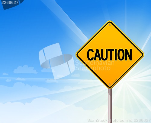 Image of Caution on blue sky background